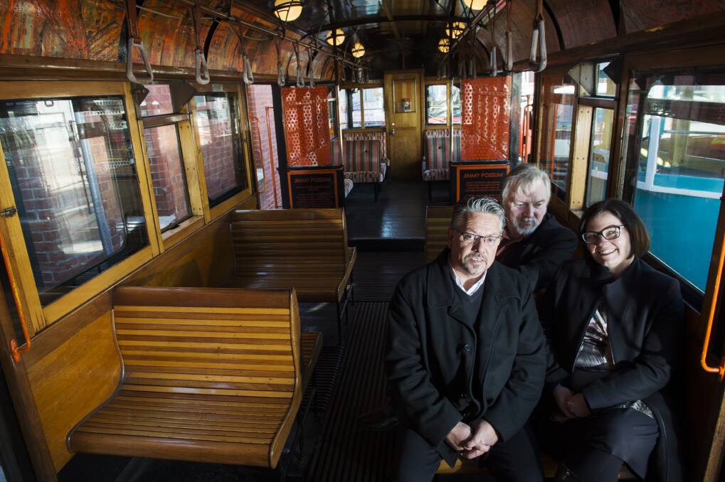 SHARING STORIES: Dja Dja Wurrung Clans Aboriginal Corporation chief executive officer Rodney Carter, Bendigo Heritage Attractions acting CEO Wayne Gregson and Bendigo MP Lisa Chesters inside the tram that will be decorated with the artwork of Aboriginal artists. Picture: DARREN HOWE