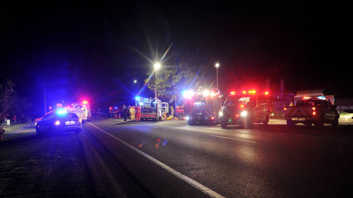 UPSETTING: Emergency services respond to a crash at Huntly on Thursday night. People suffered serious injury in the incident. Picture: NONI HYETT