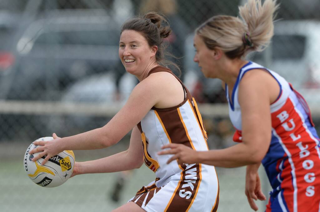 REBOUND: Huntly goal defence Kate Sloan launches the Hawks down court in Saturday's win over North Bendigo at Huntly.