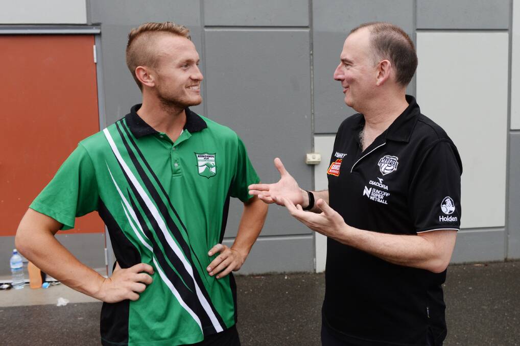 Kangaroo Flat A-grade coach Jayden Cowling and Collingwood Magpies defensive coach Rob Wright. Picture:" DARREN HOWE