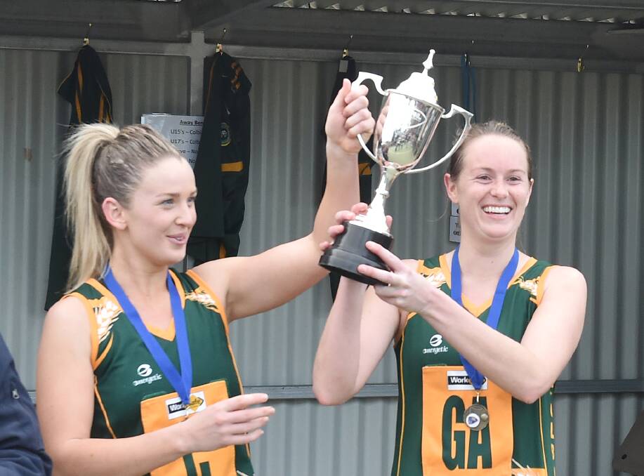 THREE_PEAT-CHANCE: Olivia McEvoy and coach Liz Cobbledick hold the premiership trophy aloft after a stunning win in last season's grand final at Huntly against White Hills. Picture: DARREN HOWE