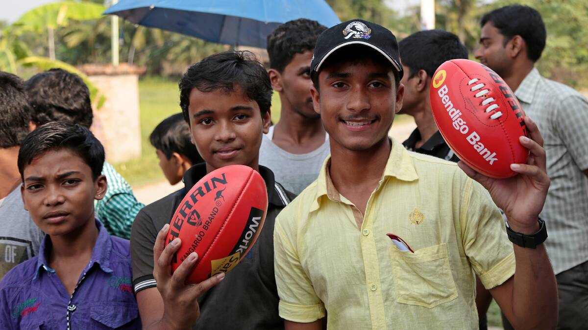 Kolkata youths with their new BFNL-supplied footballs. Picture: BOYD ROBERTSON