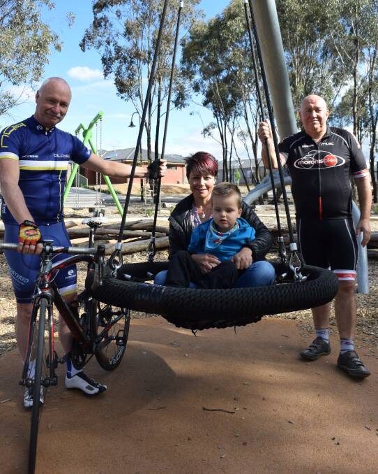 Bendigo Tour of Tasmania cyclists Graeme Pilcher and Andy Hoare with Natalie Watson and son Hamish. Picture: JASON WALLS
