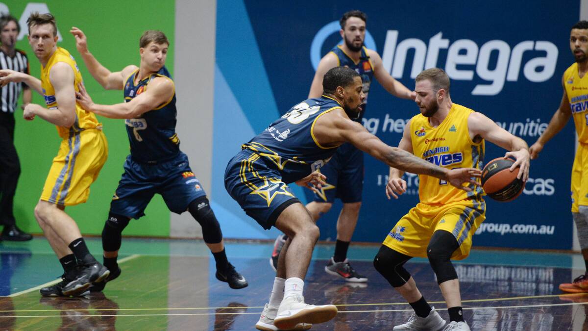 DEFENCE: Braves point guard Adam Doyle looks for a way to the basket against Ballarat Miners on Saturday night. Picture: KATE HEALY, BALLARAT COURIER