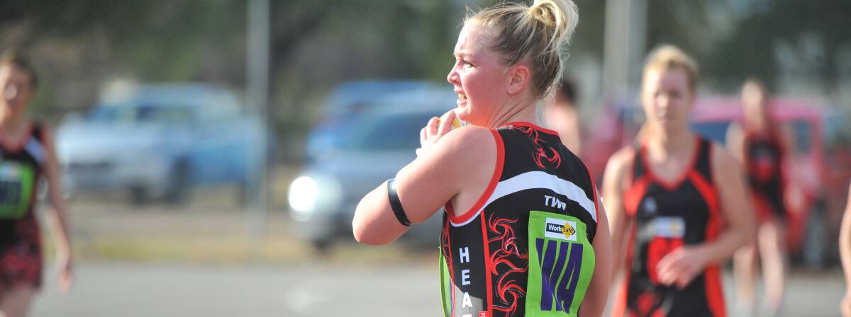 ENCOURAGING SIGNS: Tanya O'Halloran looks to send Heathcote into attack. The Saints are searching for their first win of the HDFNL A-grade netball season.