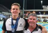 Triple gold medallist Henry Allan with his Bendigo East Swimming Club coach John Jordan at the Australian Age Championships on the Gold Coast.