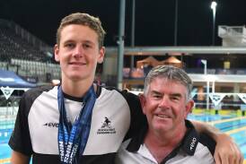 Triple gold medallist Henry Allan with his Bendigo East Swimming Club coach John Jordan at the Australian Age Championships on the Gold Coast.