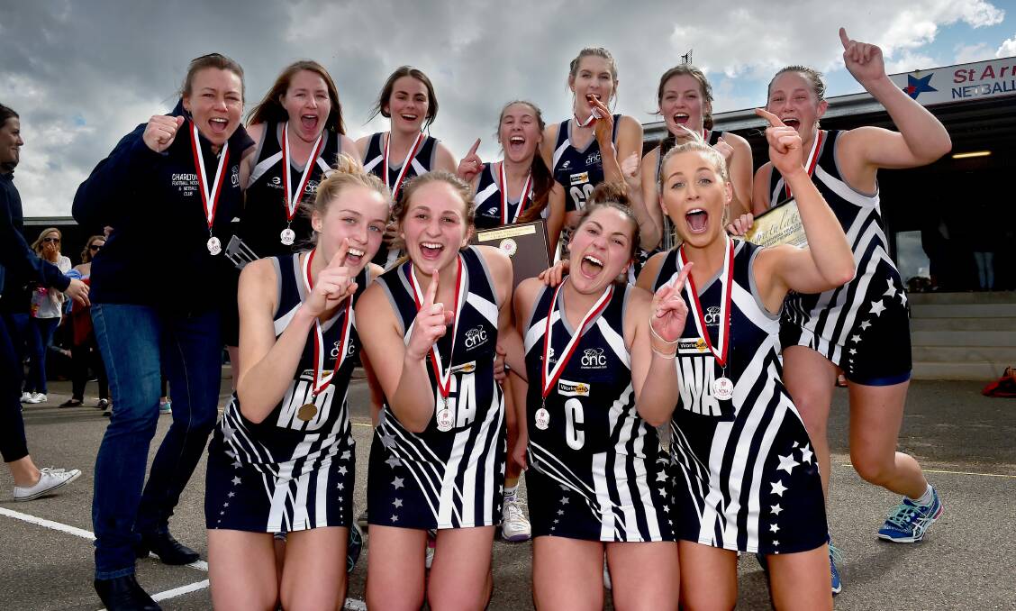 Charlton A-grade netball coach Kim Fitzpatrick (back left) celebrates the 2016 North Central Netball Association premiership win with her players.