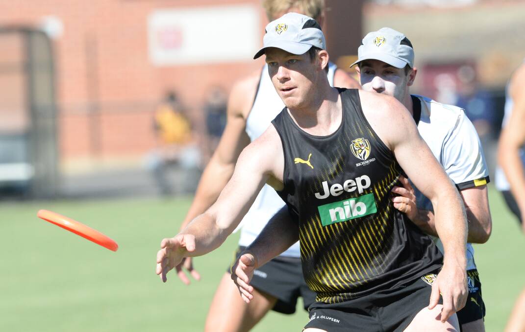 Star Richmond forward Jack Riewoldt is as accurate with a frisbee as he is shooting for goal during Tuesday's training session at the Queen Elizabeth Oval. Picture: DARREN HOWE