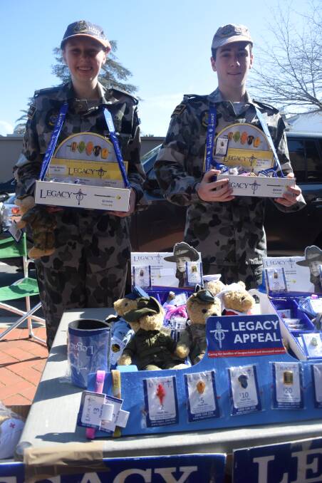 Able Seaman Jennipher Andrews and Able Seaman Corey Wilson, from the TS Bendigo Naval cadets, sell Legacy merchandise in Bendigo.