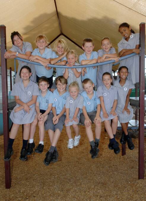 The last time Chelsea and Chloe Hall featured in the Bendigo Advertiser was in 2008, as a group of seven sets of twins starting school at Holy Rosary. They are pictured in the middle. Picture: LAURA MAKEPEACE