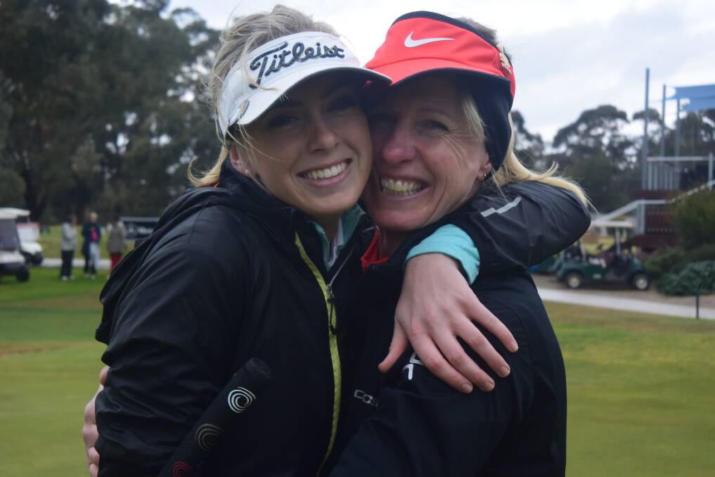 Jenni Bilkey is embraced by her daughter Kristi Bilkey after the mother's victory in Thursday's A-grade club championship final at Bendigo Golf Club. Picture: KIERAN ILES