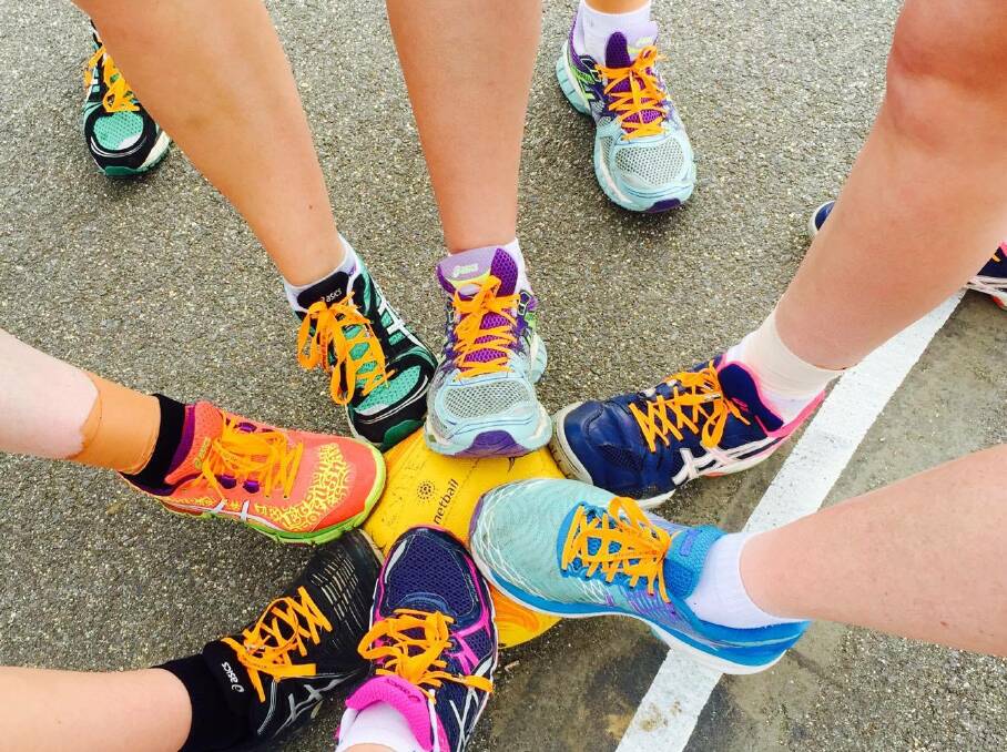 Kyneton B-reserve netballers lend their support to the Team Lace Up campaign against social violence at training this week.