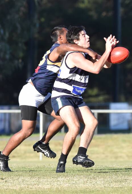 FOOTY'S BACK: Strathfieldsaye has overcome the Nauru All-Stars in a spirited practice match contest to kick-start the Storm's 2017 season campaign. Pictures: DARREN HOWE
