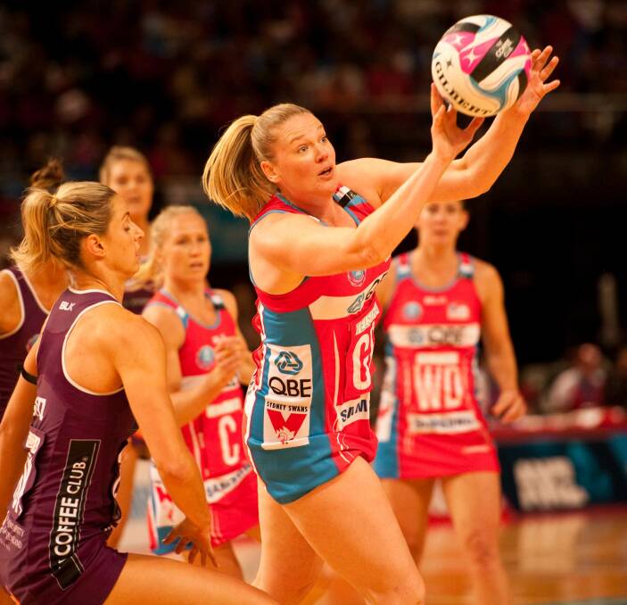 SURE HANDS: NSW Swifts goal shooter Caitlin Thwaites grabs possession of the ball during her team's win against the Queensland Firebirds. Picture: PATRICK THWAITES