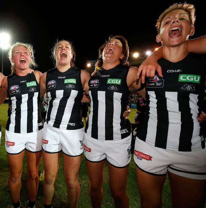 PROUD MOMENT: Emma Grant (right) and her Collingwood teammates celebrate after their breakthrough AFLW victory over Western Bulldogs.