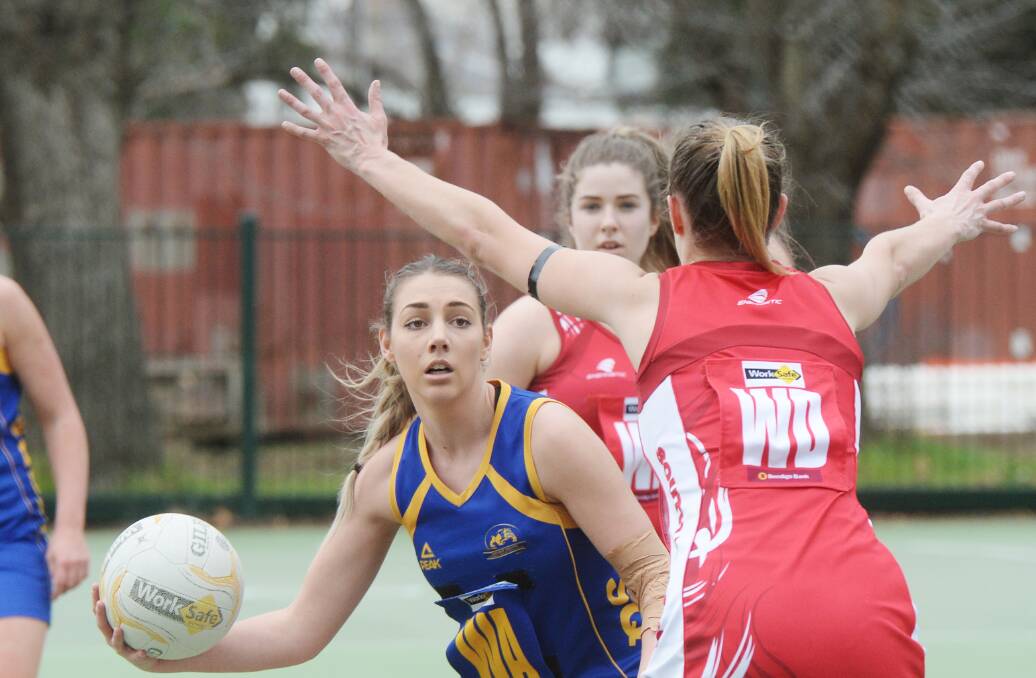 SWIFT: Delaynie Caldwell looks to send Golden Square into attack under pressure from South Bendigo's Molly Johnston. Picture: DARREN HOWE