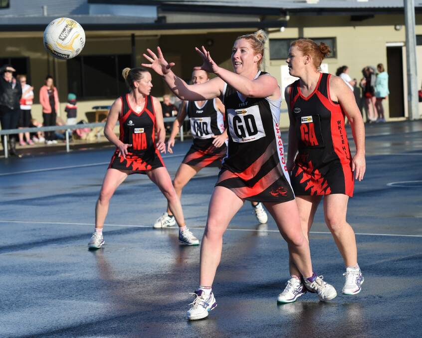 SURE HANDS: Jodie Lake has joined the ranks of athletes from a 'non-footy'background to turn their hand to football. She will continue to coach and play netball.