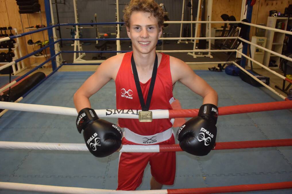 Tully Scanlon with his gold medal won at Boxing Australia’s Youth and Junior National Championships. Picture: KIERAN ILES
