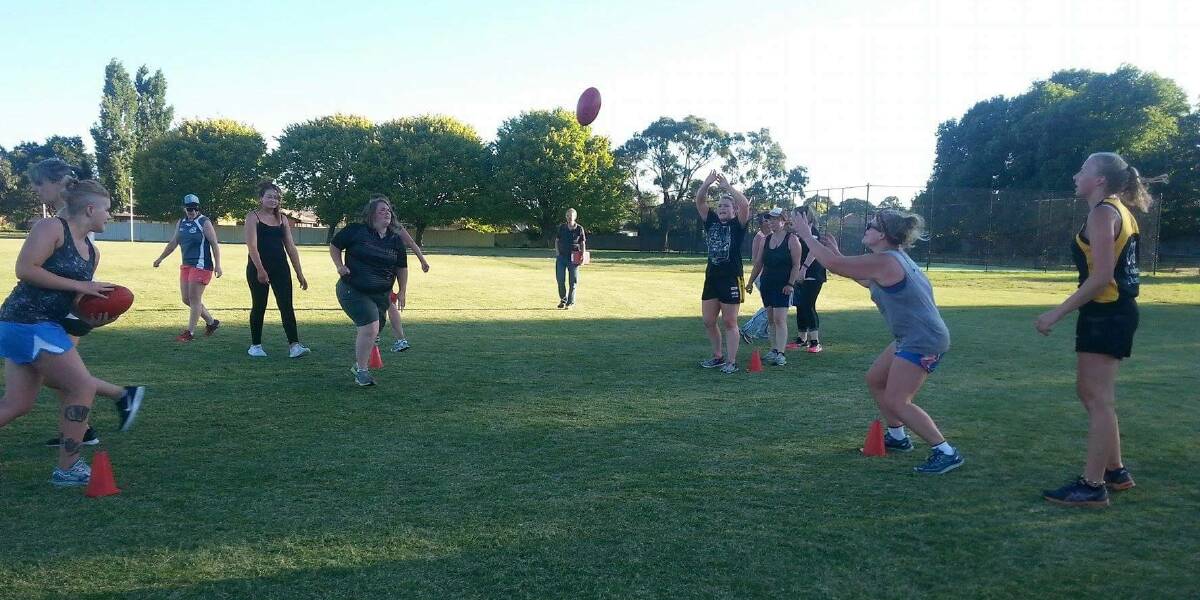 Kyneton women's footballers go through their paces at the lower oval at Kyneton Showgrounds.