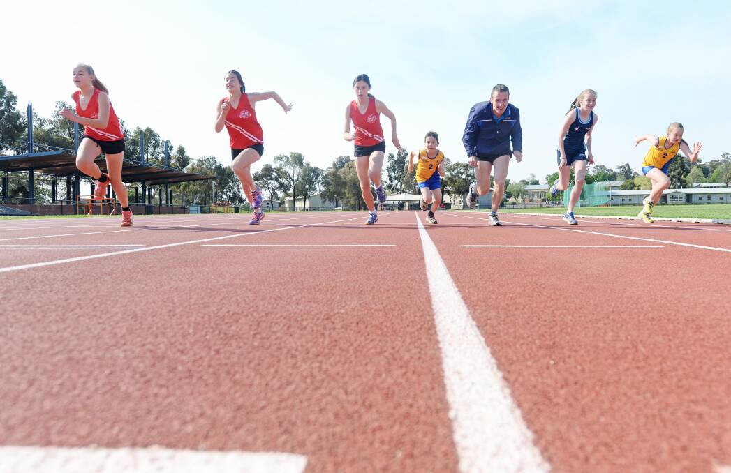 GO: Athletes, Keely, Ella, Luke, Craig Green, Miah and Georgia prepare for the 2015-16 Athletics Bendigo season, which starts this Friday and Saturday. Picture: DARREN HOWE