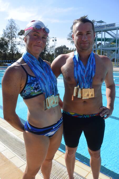 Dean Shard and Cindy Nicholls at the Bendigo Aquatic Centre, where they train five times a week. Picture: KIERAN ILES