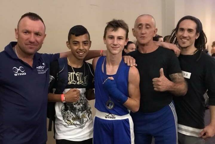 Jake May (centre) with his trainers Frank Pianto, Garry Austin and two-time Australian champion Jared Kum-Too, and Victorian 50kg junior champion Rocco Brigante.