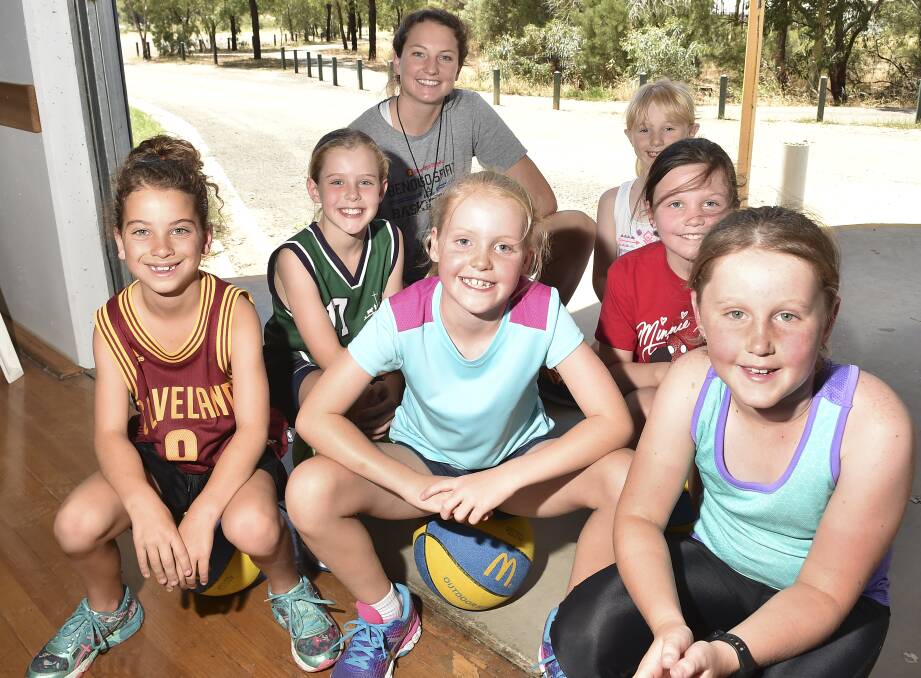 QUEEN OF THE KIDS: Kelsey Griffin among young fans at this week's joint Bendigo Spirit-Bendigo Braves school holiday camp at Bendigo Stadium. Picture: NONI HYETT