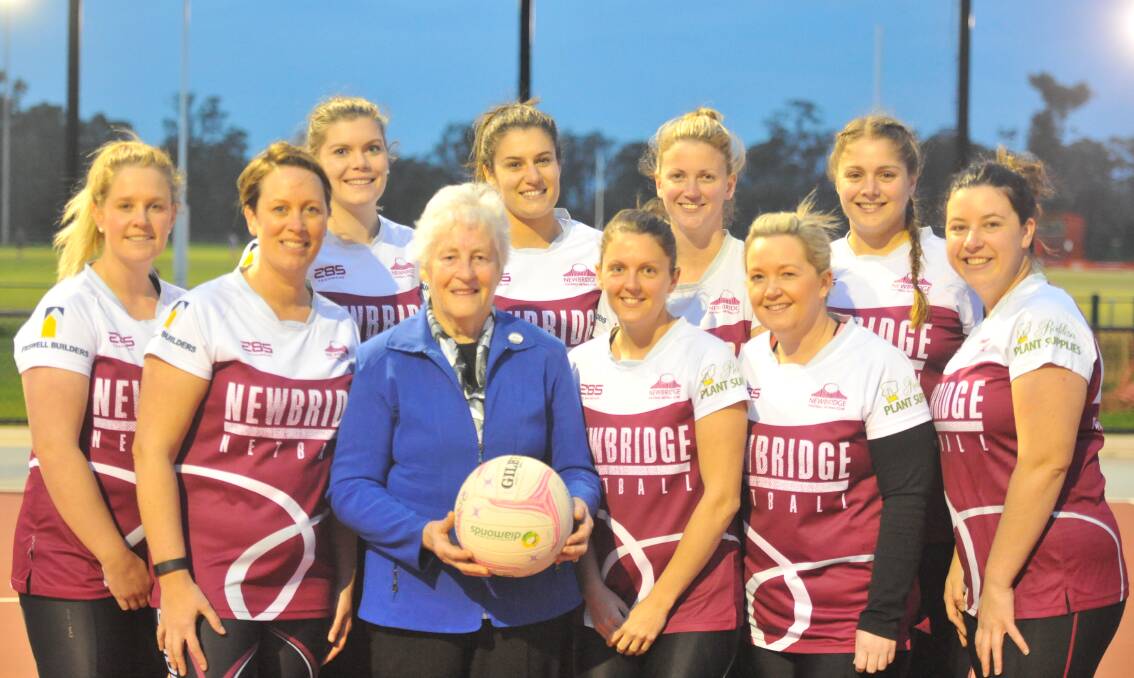 Isobel Hamilton is surrounded by Newbridge's current A-grade squad, including coach Carmen Shevlin (second from left). The Maroons will play Mitiamo in Saturday's LVFNL A-grade grand final. Picture: KIERAN ILES