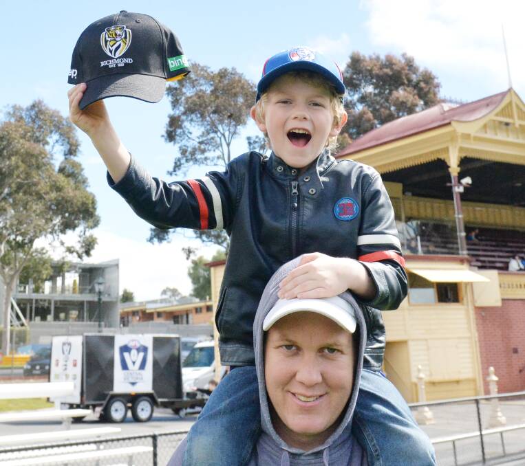 DAY OUT: Ryan McLean and Jamie McLean enjoy their day at the AFL Central Victoria Footy Festival at the QEO.