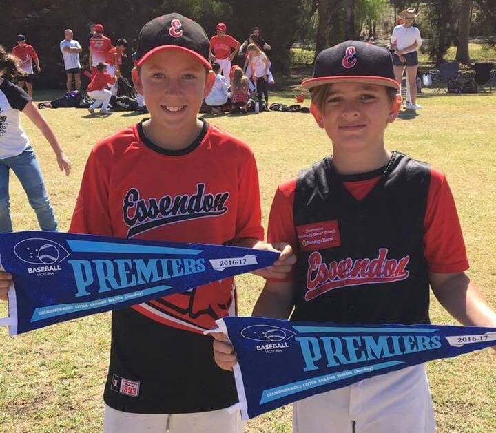 CHAMPIONS: Harry Fitzgerald and Cash Curwood with their premiership pennants after Sunday's grand finals in Melbourne. The pair play for Essendon.