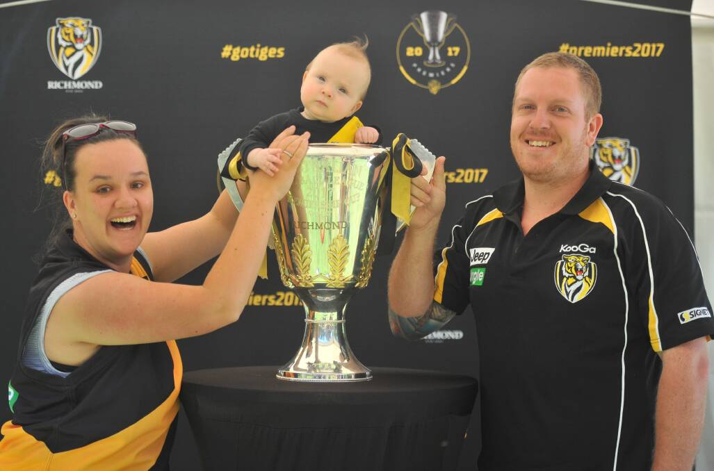 Tracy and Jake Richardson, daughter Codi and the premiership cup. Picture: KIERAN ILES