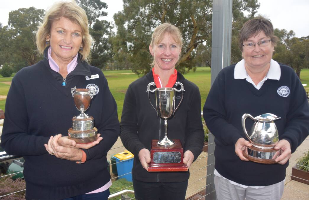 Club champions Angela Dudley (C-grade), Jenni Bilkey (A-grade) and Lyn Harding (B-grade with their trophies after yesterday's finals. Picture: KIERAN ILES