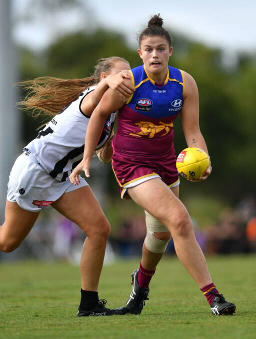 Bella Ayre looks to get a handball away against Collingwood. Picture: FAIRFAX MEDIA