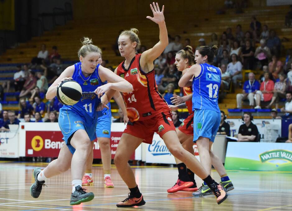 Ashleigh Spencer drives to the basket against the Townsville Fire at Bendigo Stadium. Picture: DARREN HOWE