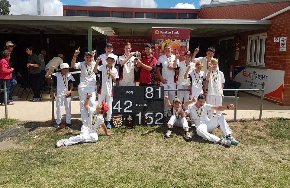 GROUNDBREAKING: Arnold junior cricketers and their coach Ashley Younghusband celebrate their first premiership since 1971-72 at Bridgewater last Saturday.