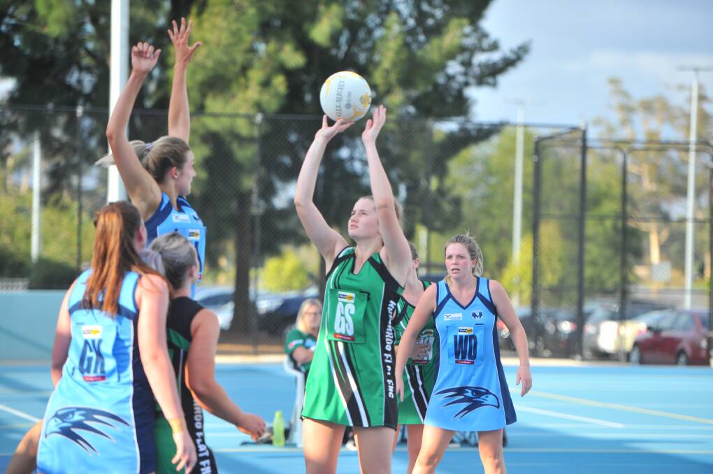 COOL UNDER PRESSURE: Kangaroo Flat's Ruby Barkmeyer nails a crucial shot late in the final quarter of Saturday's comeback win over Eaglehawk at Canterbury Park. Picture: ADAM BOURKE