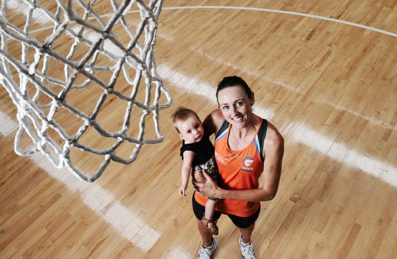GIANTS Netballer, Bec Bulley, with her child Indie at Sydney Olympic Park, in February last year. Picture: PETER BRAIG