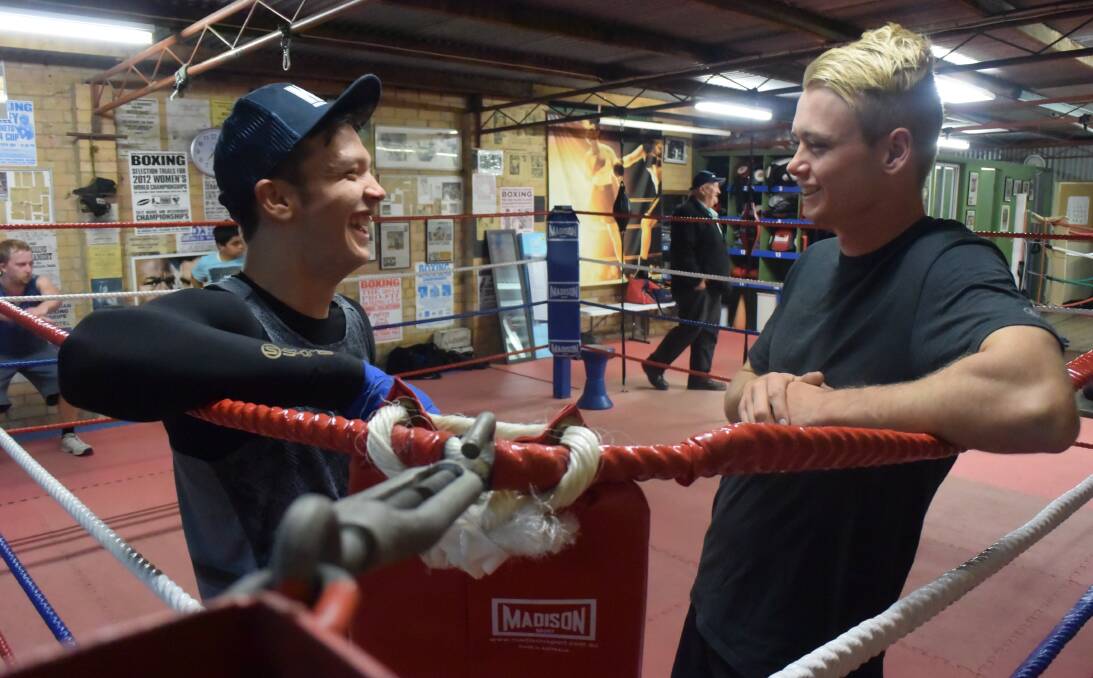 Sparring partners Brad Morgan and Matt Hall share a joke during training at Connollys Gym in California Gully. Picture: KIERAN ILES