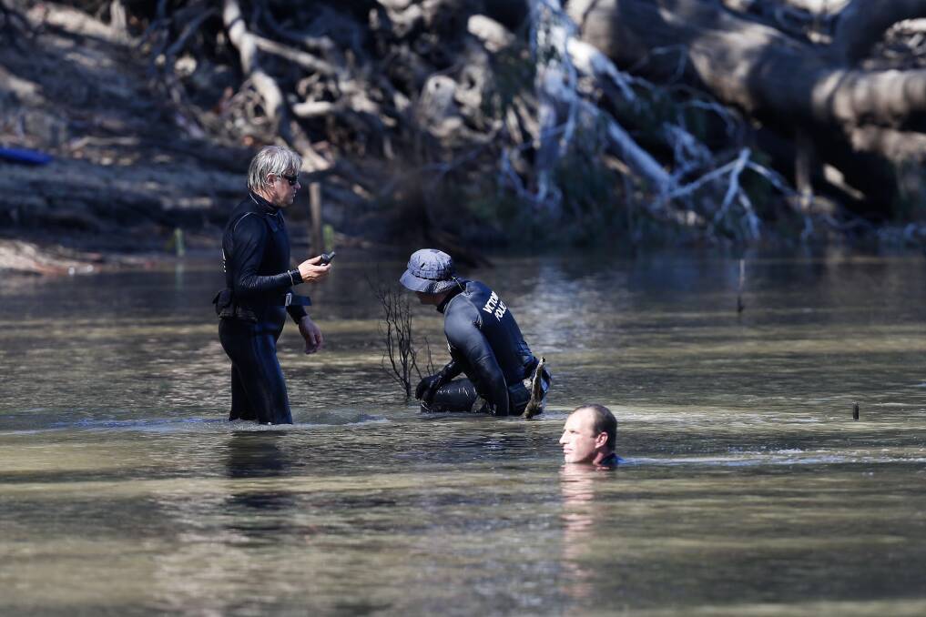 Police divers search the Murray River earlier this month. Picture: Riverine Herald