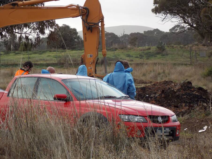 CLEAN UP CREW: Asbestos-accredited crews were called in to clean up a rubbish pile burnt by the CFA the previous day. The CFA were led to believe it didn't contain asbestos, according to Central Goldfields Shire Council's mayor. Picture: Supplied
