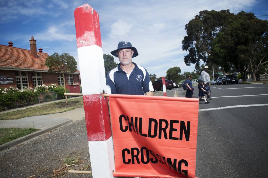 WAITING GAME: Former Quarry Hill PS Principal, Andrew Schaeche, at the crossing where the school has petitioned council to provide formal supervision. Picture: DARREN HOWE
