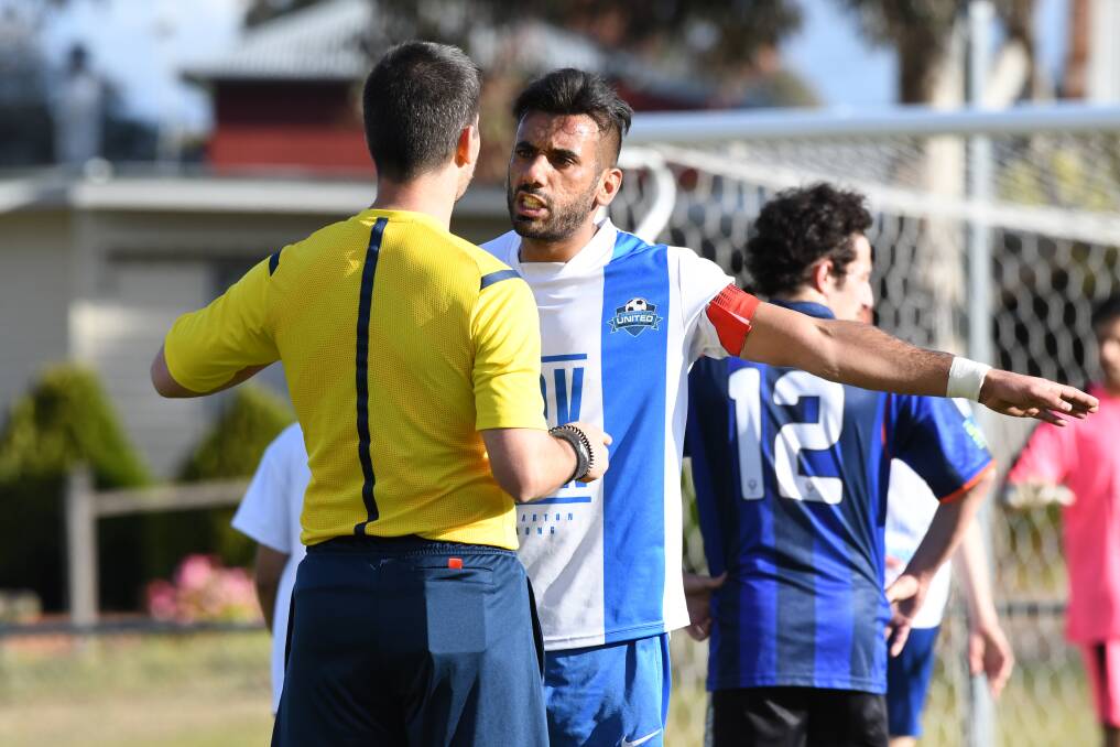 DISCIPLINE: Two red and four yellow cards were brandished by referee Elias Andrews  during a fiery encounter at Truscott Reserve on Sunday. Picture: NONI HYETT
