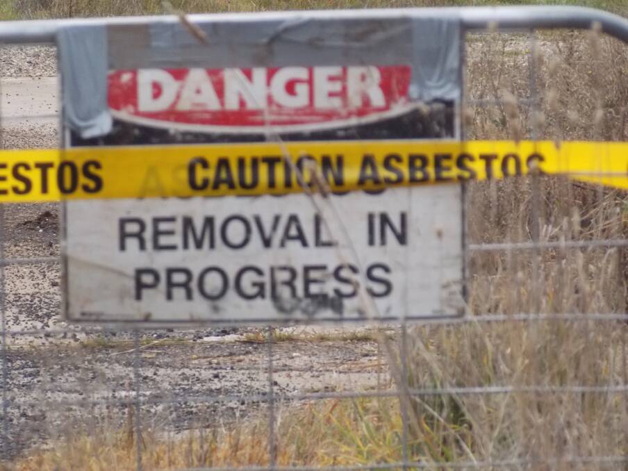 DANGER: Signs erected during the clean up of a rubbish pile burnt by the CFA who were led to believe it wasn't toxic. Picture: Supplied
