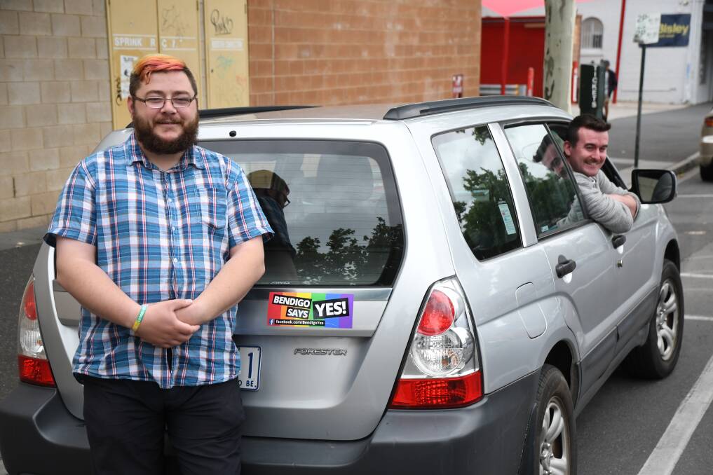 BUMPER: Nat Wingrave and Harry McAnulty set out for Canberra, ready to celebrate marriage equality becoming law. Picture: MARK KEARNEY