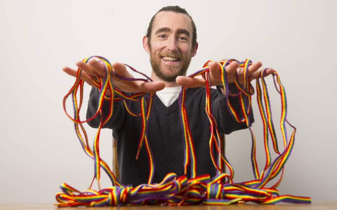 BRIGHT: An Equal Footing founder Matt Keane shows off the rainbow laces he's using to campaign for marriage equality. Picture: DARREN HOWE