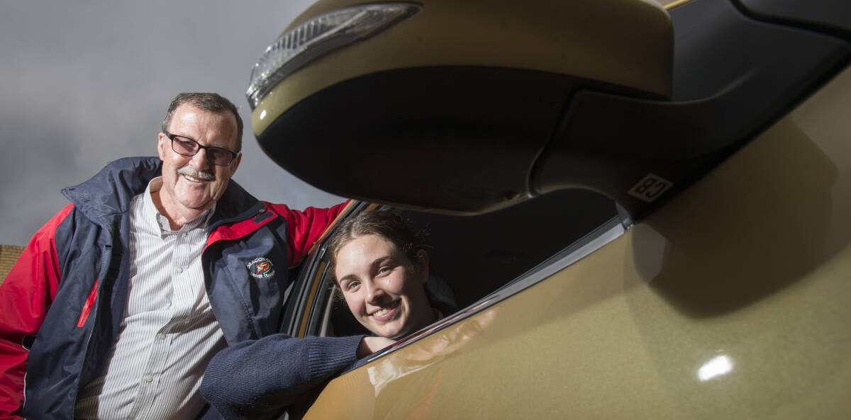 CAR CARE: Driving instructor Greg Penno prepares 17-year-old Zoe Ferns for her driver's licence exam. Picture: DARREN HOWE  