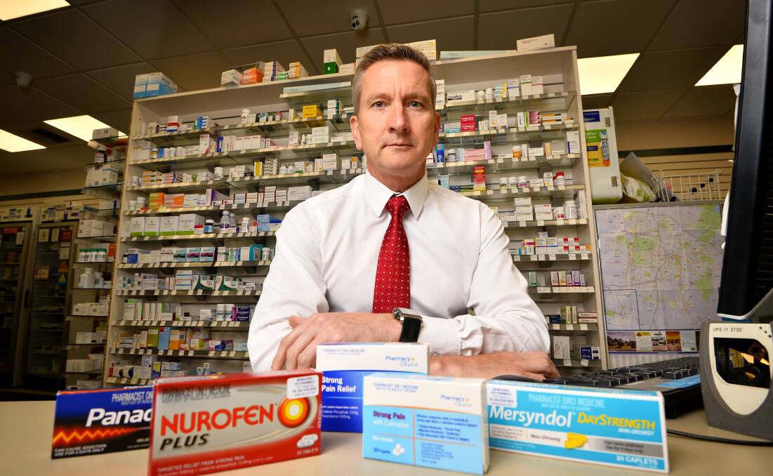 BANNED: UFS pharmacy clinical advisor Peter Fell with some of the codeine products that will no longer be available over the counter at pharmacies from February 1. Photo: Dylan Burns.
