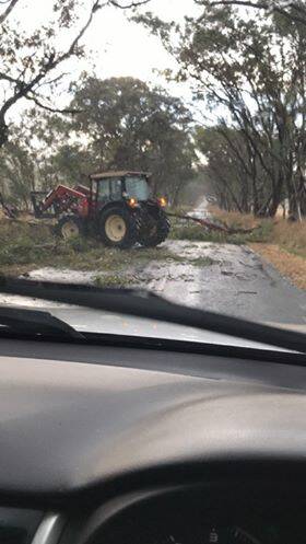 Locals help clear the roads on the Sutton Grange - Redesdale Road.