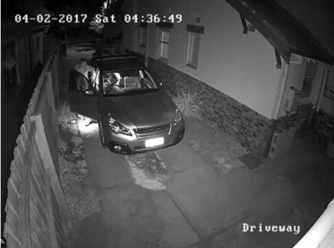 Thieves caught on camera rummaging through car